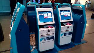 Self-service check-in kiosks at Bucharest Henri Coandă Airport